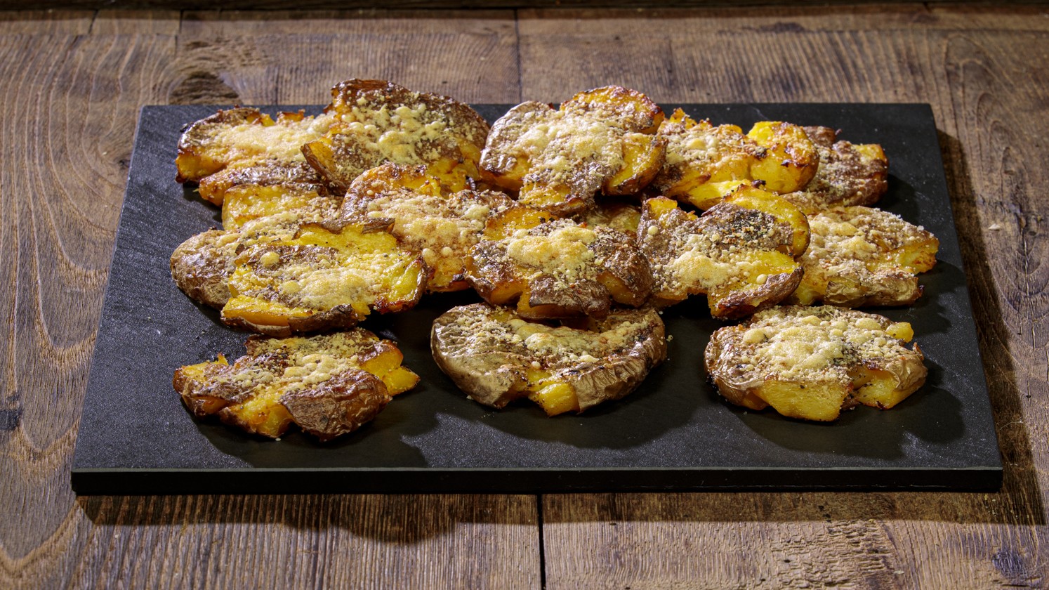 Patate schiacciate al forno