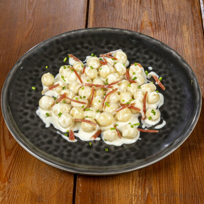 Gnocchi di pane, fonduta e prosciutto di Parma